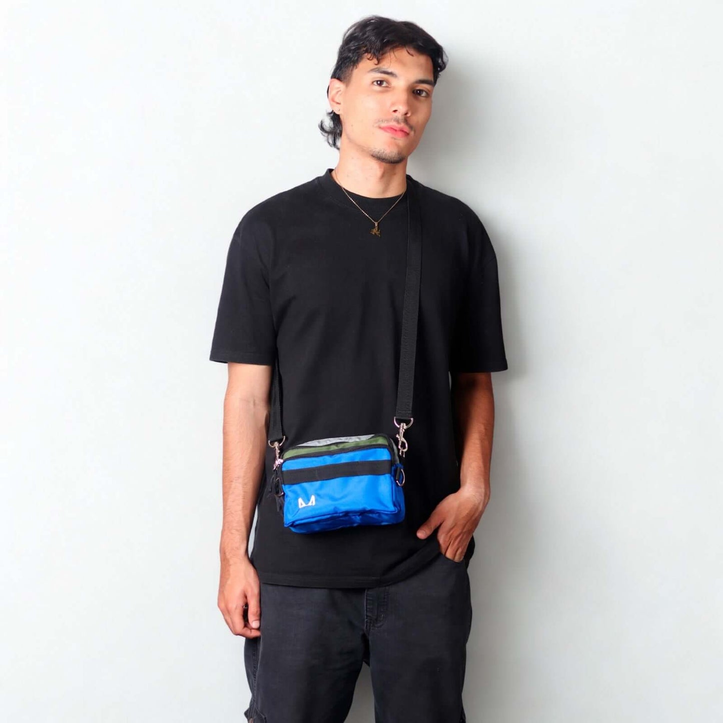 Male model wearing fanny pack as a crossbody