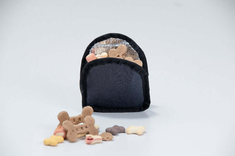 Removable insulated sleeve with small bones on a light gray background