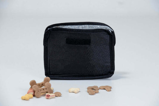 Black insulated sleeve for dog treats on a light gray background