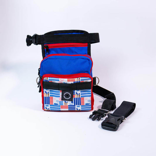 Multicolored thigh dog treat bag with straps on a white background