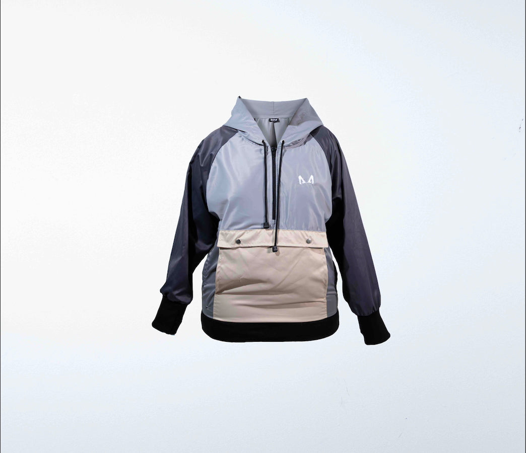Multicolored gray and beige dog training windbreaker with a logo on a light gray background