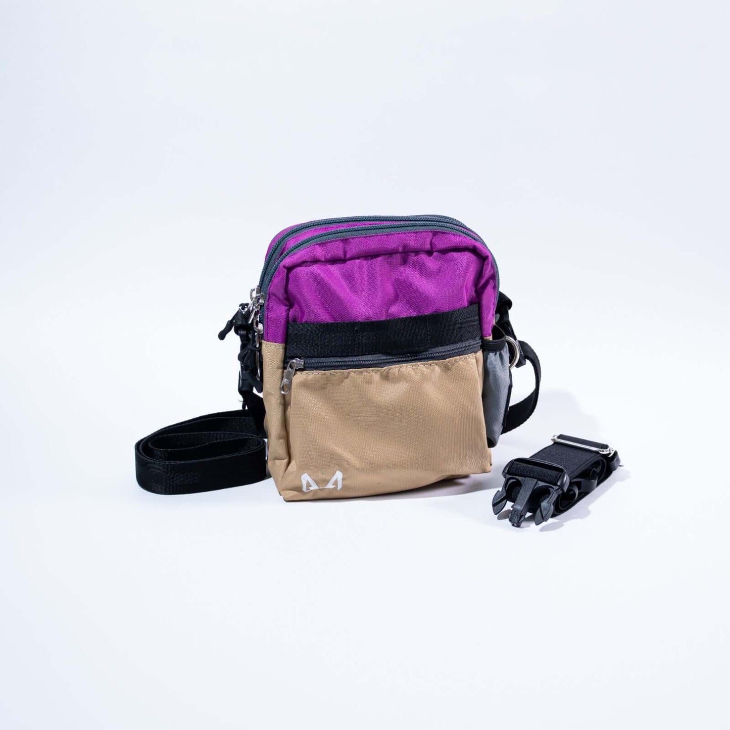 Cross body dog training bag lilac and beige with a black strap, on a white background.