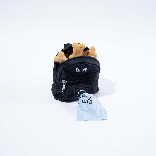 Black dog poop bag and treat holder on a white background