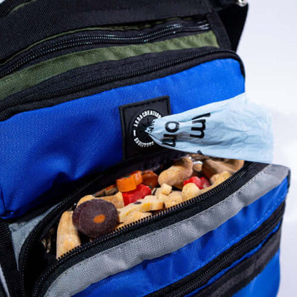 Blue backpack with snacks and a visible brand logo on a white background