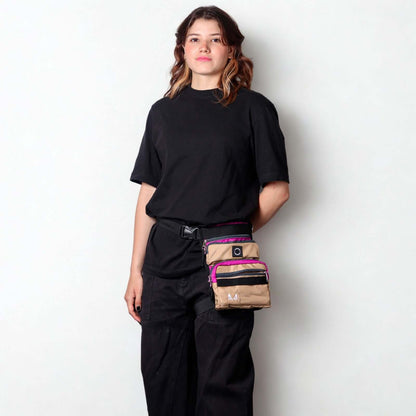 Female model wearing the lilac and beige slim fit thigh dog treat bag