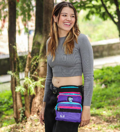Female model wearing the multicolored slim fit dog thigh treat bag